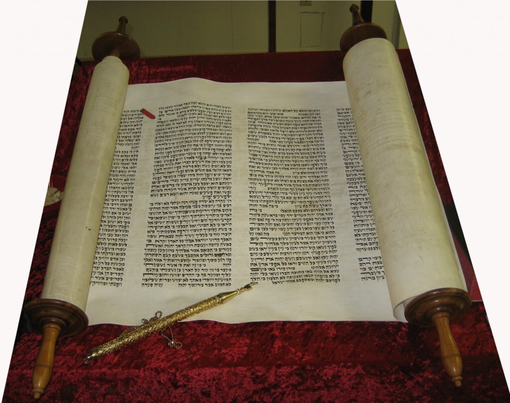 The Lamb Isaiah 53 shown on a Hebrew Scroll of Isaiah