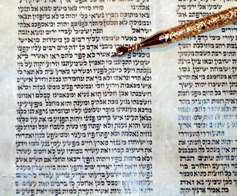 The Lamb Isaiah 53 shown on a Hebrew Scroll of Isaiah - "Who hath believed?"