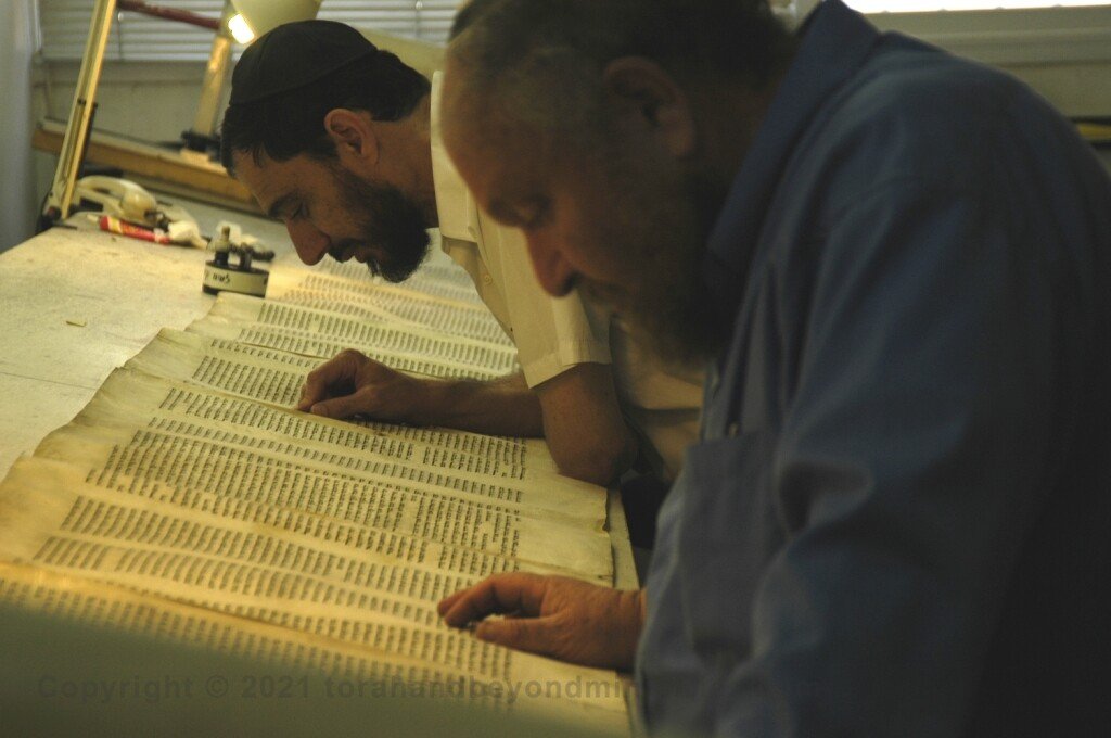 The Scribe Two Soferim checking a Torah Scroll at Macon OT in Jerusalem