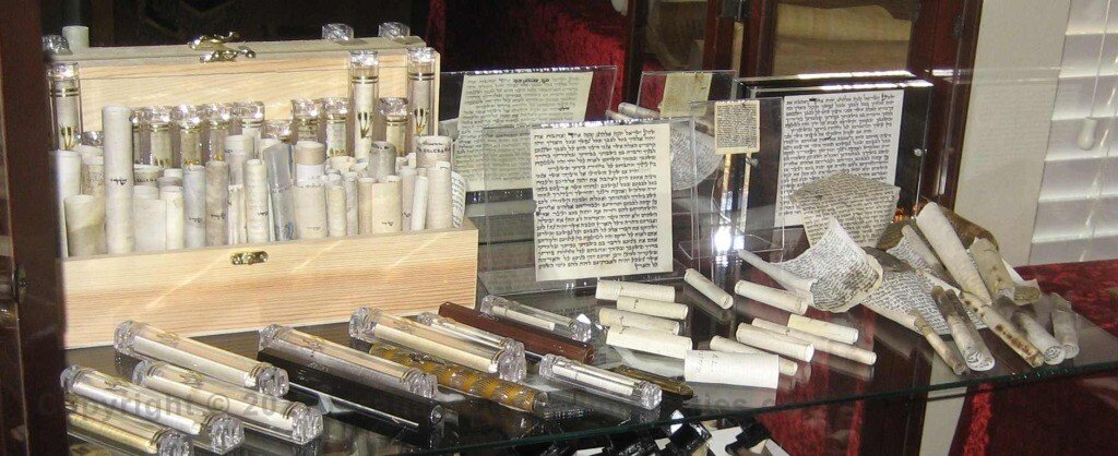 The Scribe The Mezuzah is a small scroll containing verses from the Torah.